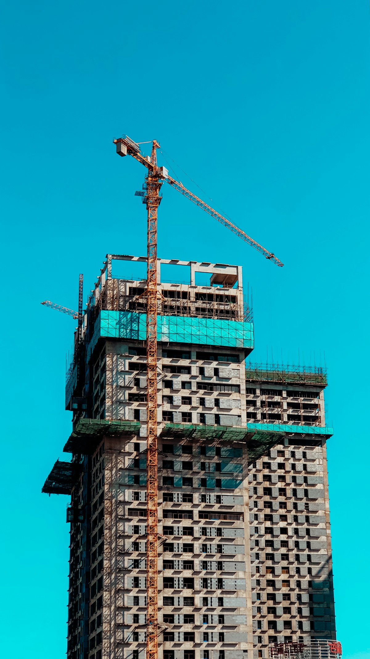Construction site with a crane on a new residential building